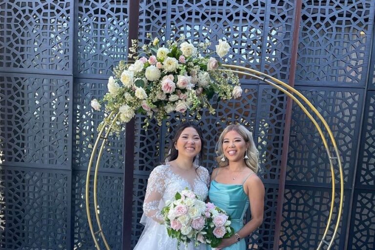 Gold hoop arch with white and blush flowers